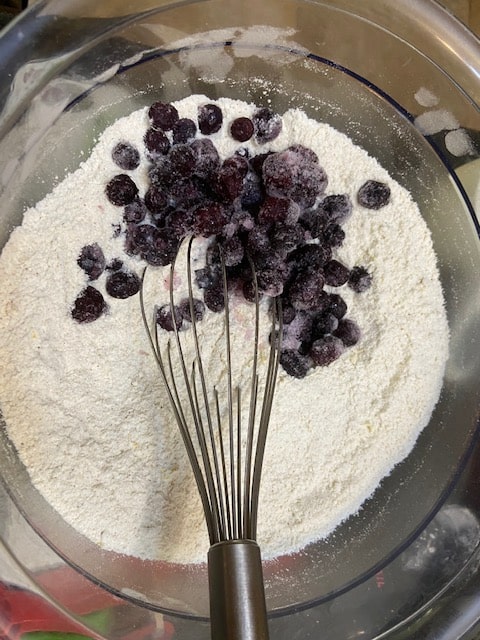 putting in the blueberries