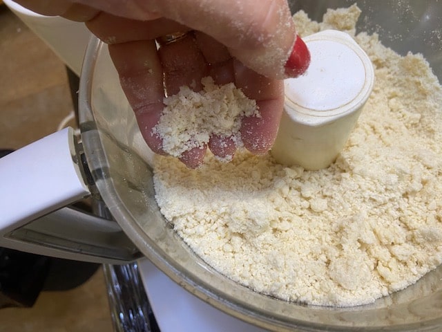 pulsing the butter/marg with the dry ingredients till crumbly