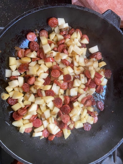 onion, apple and sausage sauteeing