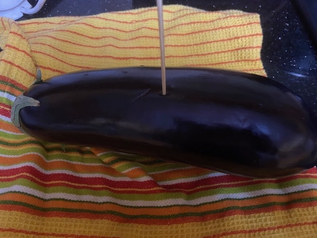 poking deep holes in the eggplant