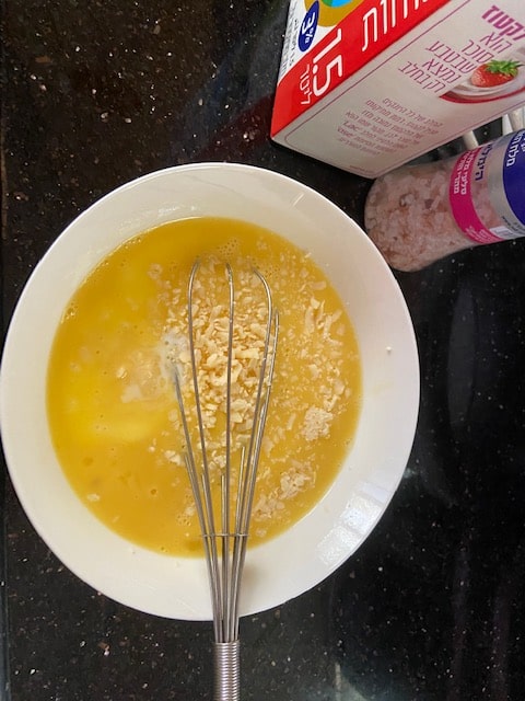 whisked eggs with some milk and cheese
