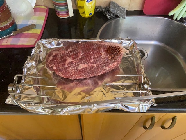 roast with rotisserie spit and forks