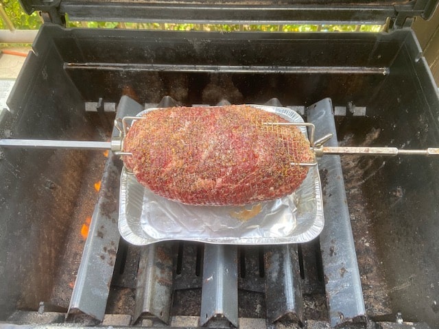 adjusting the roast to the center of the grill