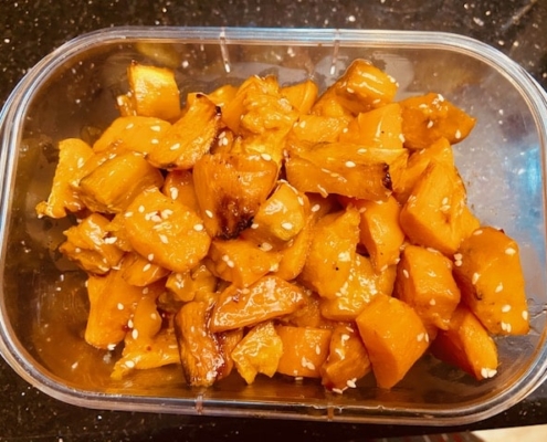 Oven fried sweet potato cubes in sweet chili and sesame