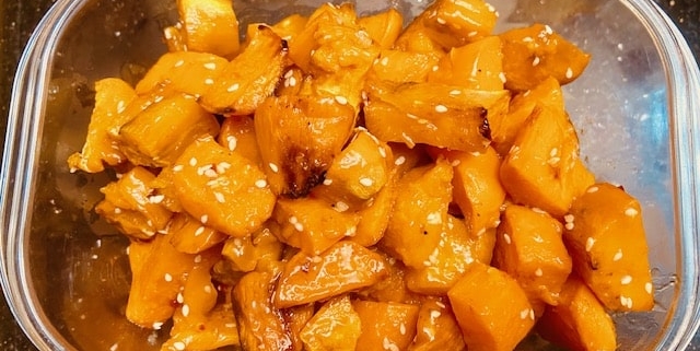 Oven fried sweet potato cubes in sweet chili and sesame