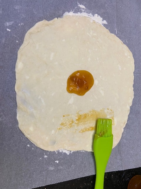 rolled out dough with jam