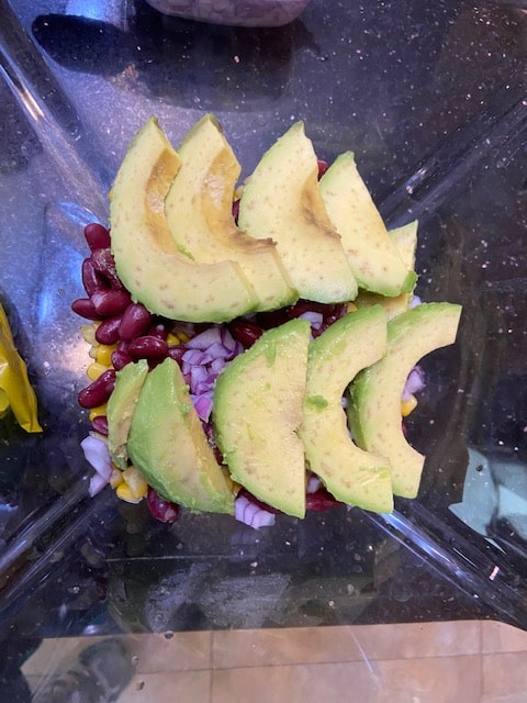 scooped and sliced avocado