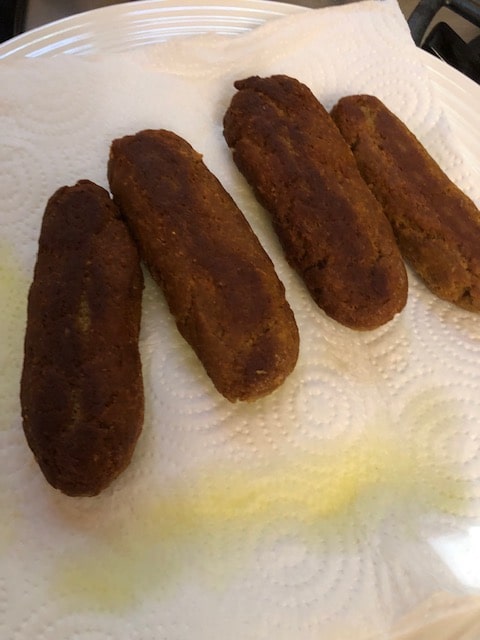draining the browned and crispy kebabs