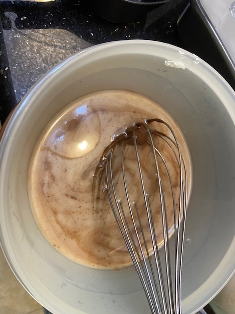 whisking butter and chocolate together