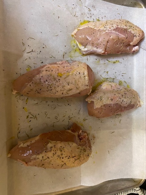 chicken drizzled with olive oil, salt, pepper and rosemary