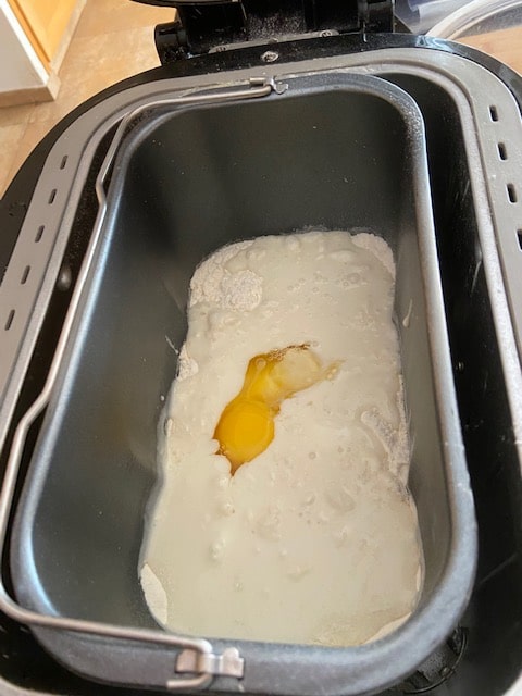 adding the mil, butter and eggs