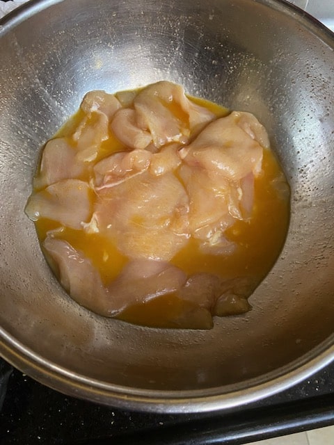 shnitzel in eggs, oil and spices
