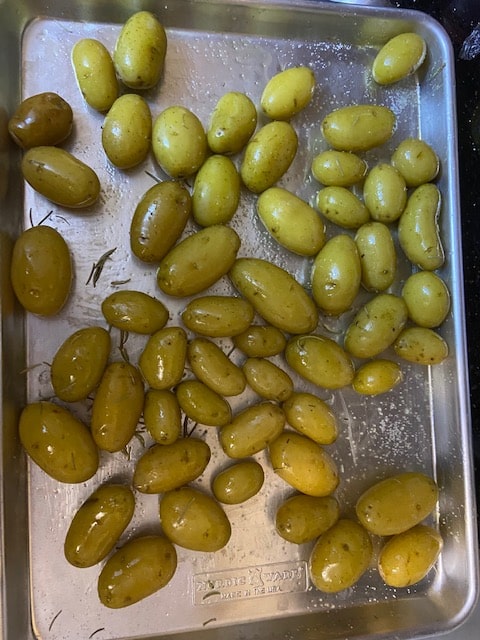 new potatoes on baking sheet