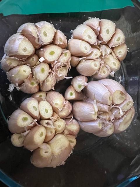chopping off the tops of the cloves