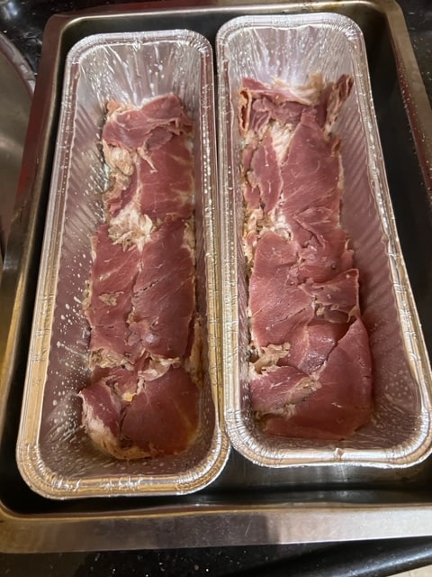 lining tins with pastrami
