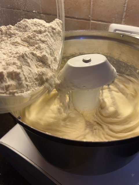 Adding dry ingredients 1/3 at a time