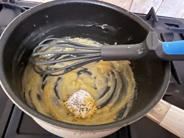 whisking the butter/flour mixture with the spices