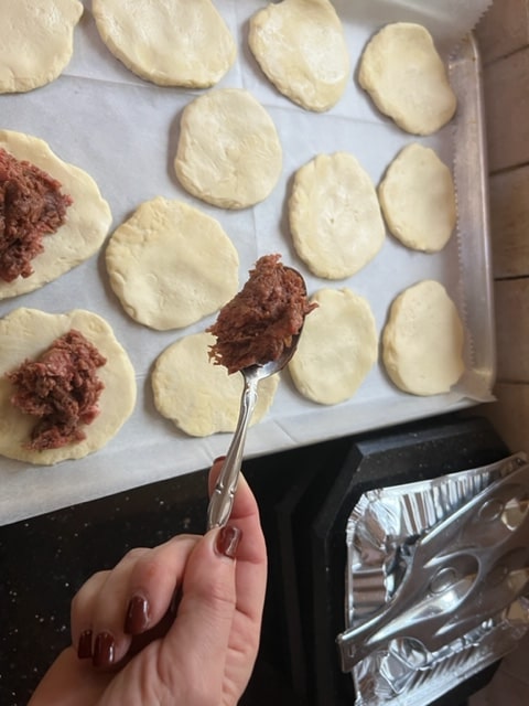 heaping tablespoons of meat mix for dough