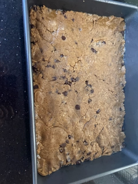 spread the dough into the pan evenly