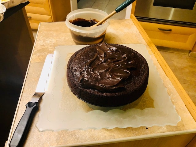 frosting the top of the cake