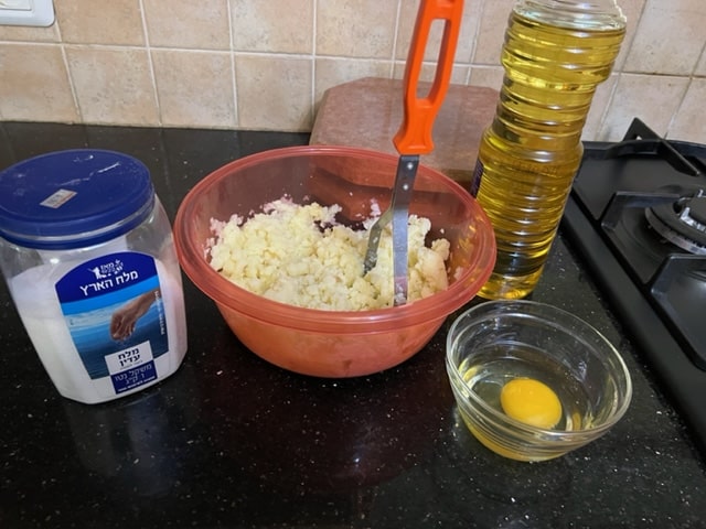 mashing the potatoes