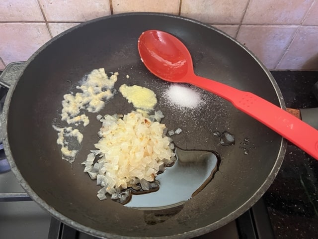 lightly sauteeing the onion, garlic and ginger