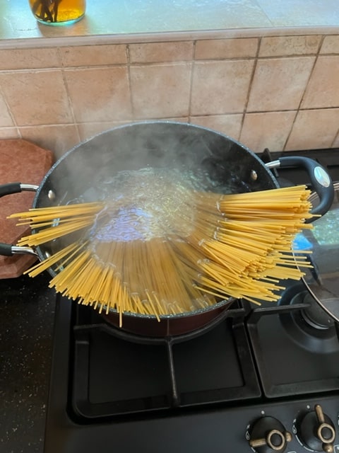 put spaghetti whole into boiling water