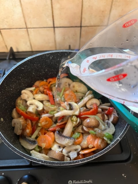 adding the water to the pot