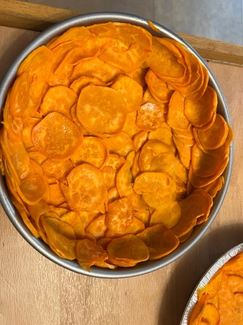layering the sweet potatoes as a crust