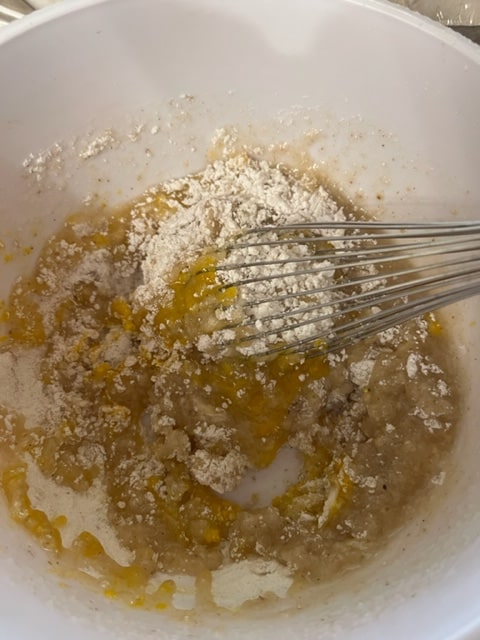 adding the egg and oil