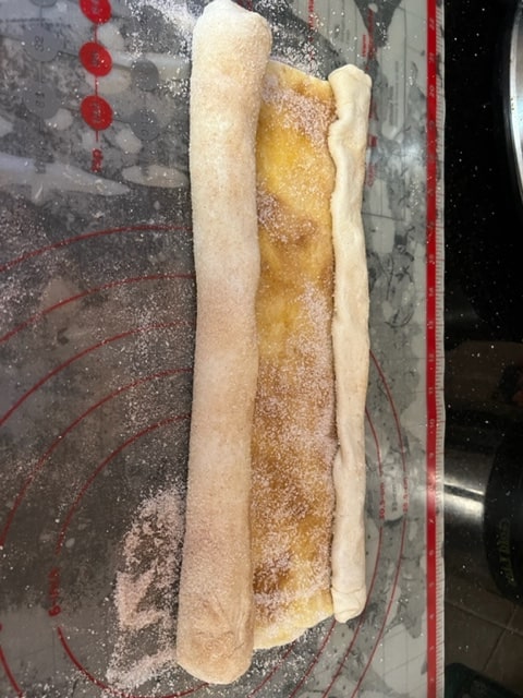 rolling the other end into the middle