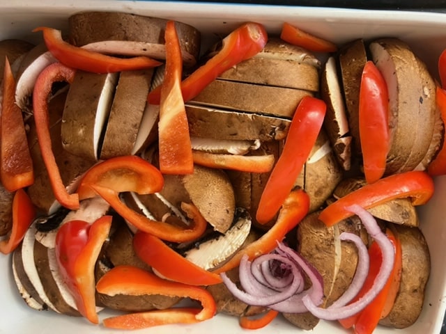 pack the mushrooms as close to whole as possible with red pepper tucked in
