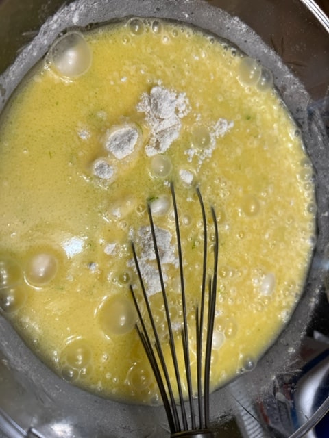 adding wet ingredients to dry ingredients