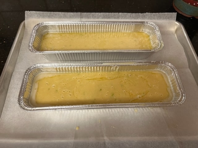 pour batter evenly between 2 pans