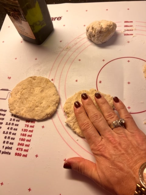 pat dough balls into circles