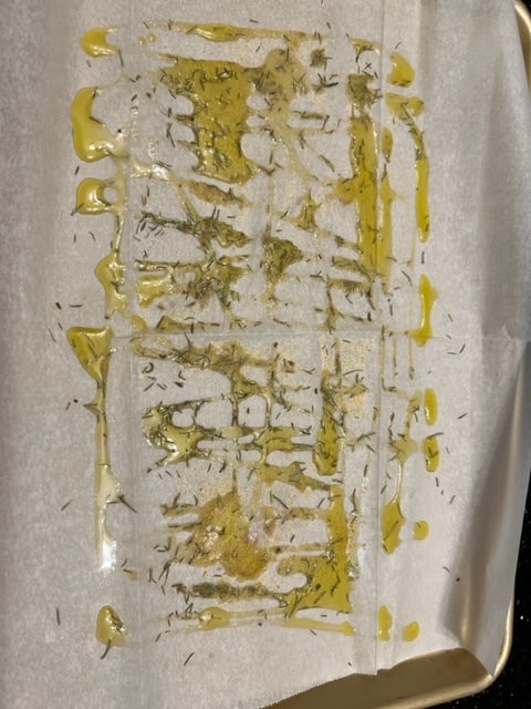drizzling the oil and spices right on the parchment paper