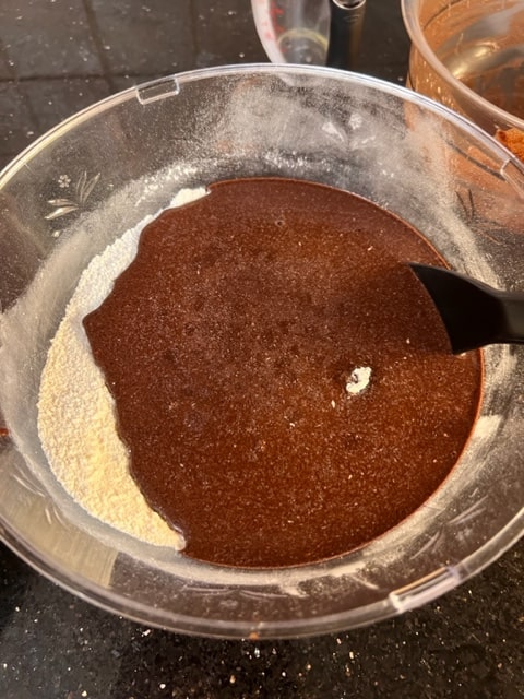 adding chocolate mixture to dry ingredients