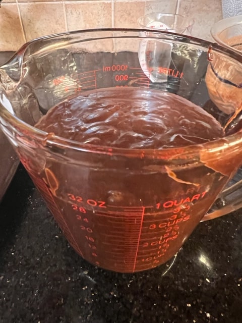 pouring the batter from a measuring cup