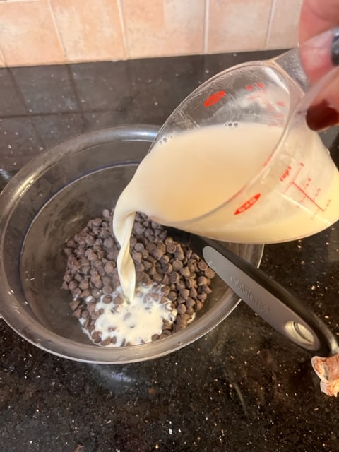 pour the hot cream over the chocolate chips in a bowl