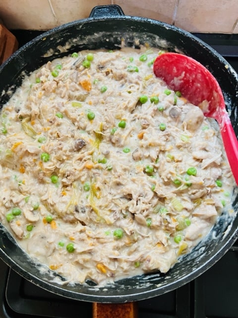 cooked cream sauce, chicken and vegetables