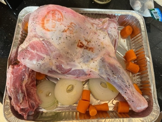 lay the lamb on the bed of vegetables