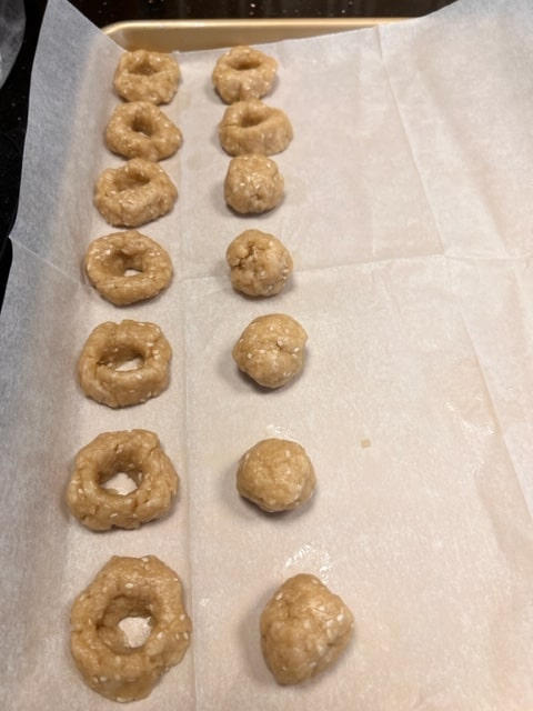 The balls of dough next to the rings