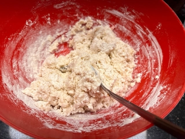 mixing together and scraping from bottom and sides