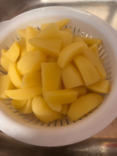 draining potatoes in colander