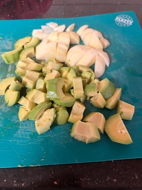 cut the avocados and apples into similar sized cubes