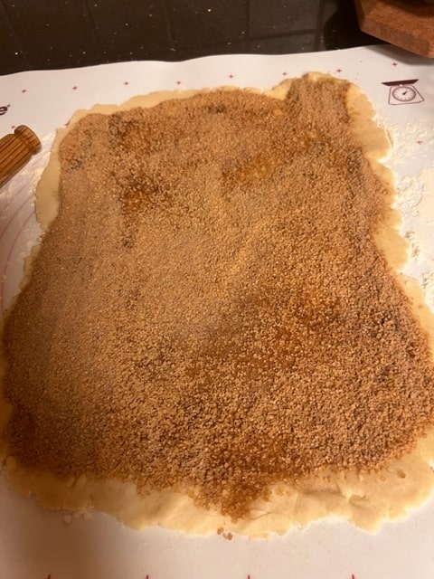 sprinkle cinnamon sugar over oiled dough