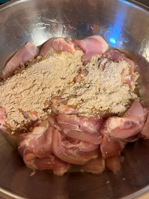 sprinkle cornstarch/spice over oiled chicken