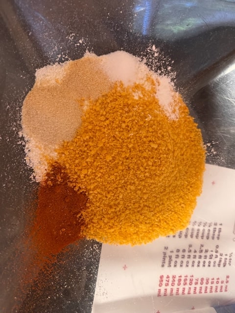Mix together the breadcrumbs, flour and spices with the baking powder