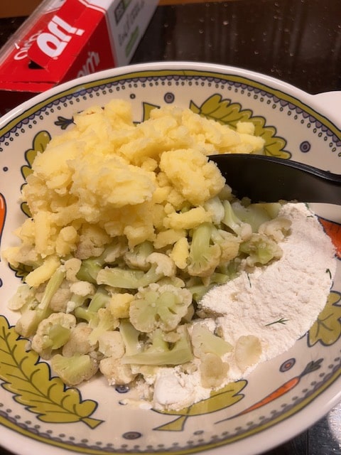 adding cauliflower and mashed potatoes
