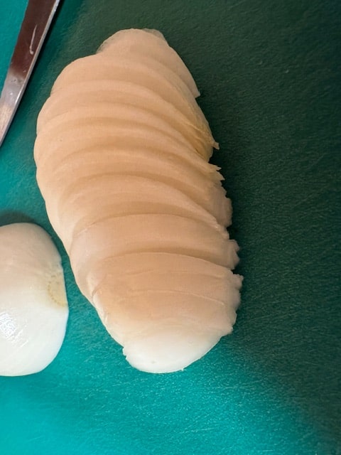slice onions into half moon slices